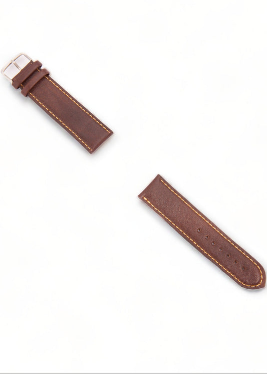 Brown leather watch strap on a white background