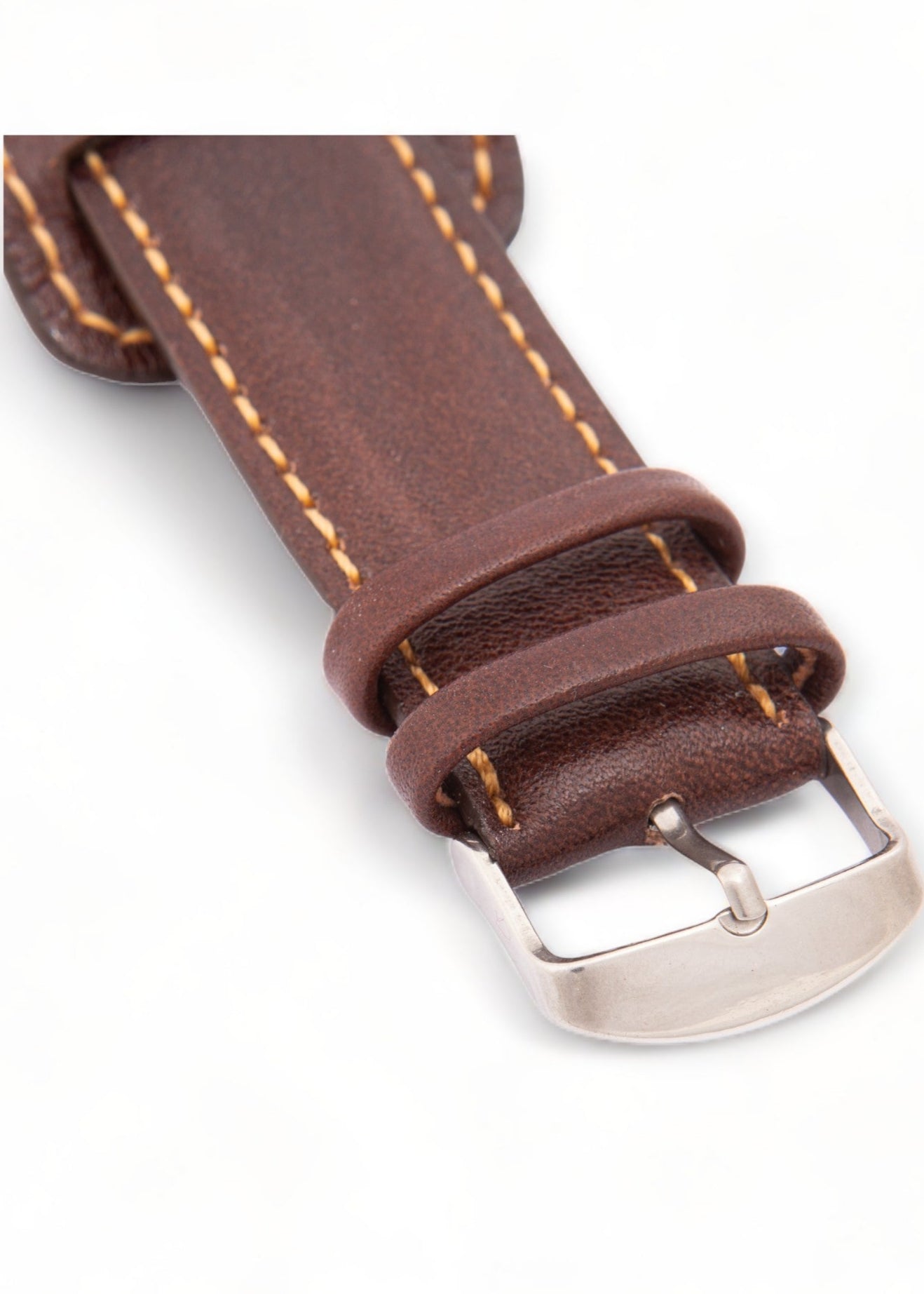 Brown leather watch strap with silver buckle on a white background