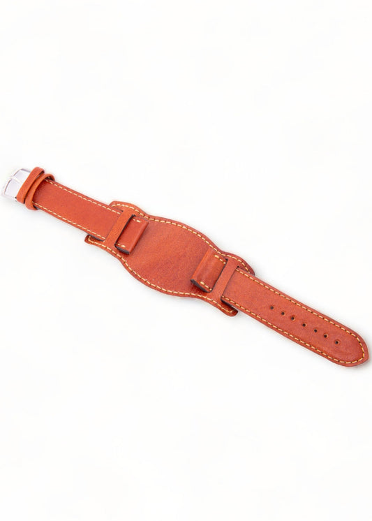 Brown leather watch strap on a white background