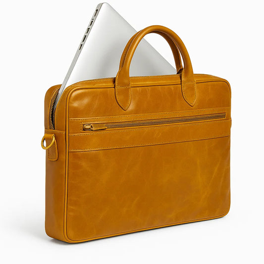 Brown leather briefcase with a laptop peeking out on a white background